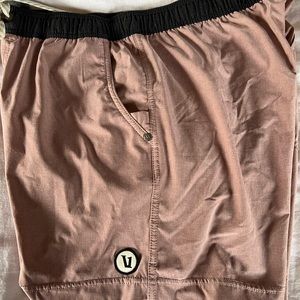 Worn more than once M Vuori shorts with liner light pink with grey liner
